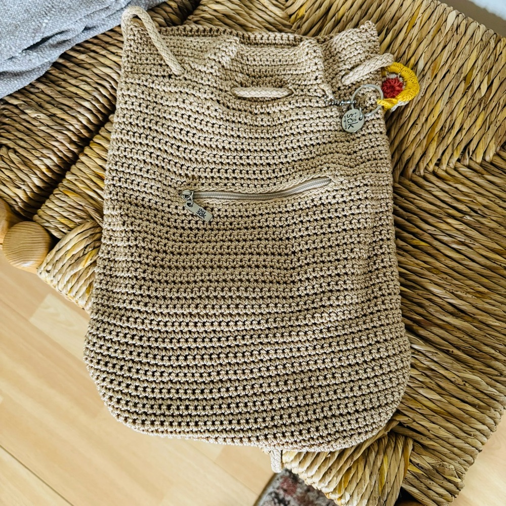 The Sak crochet drawstring backpack with zip pocket